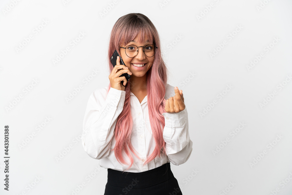 Young business mixed race woman with pink hair holding a mobile isolated on pink background making money gesture Young business mixed race woman with pink hair holding a mobile isolated on pink background making money gesture