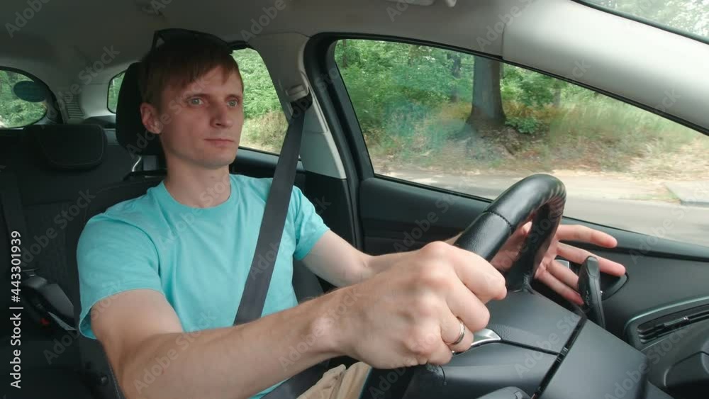 Man drives out on highway slow motion car interior Man drives out on highway slow motion car interior