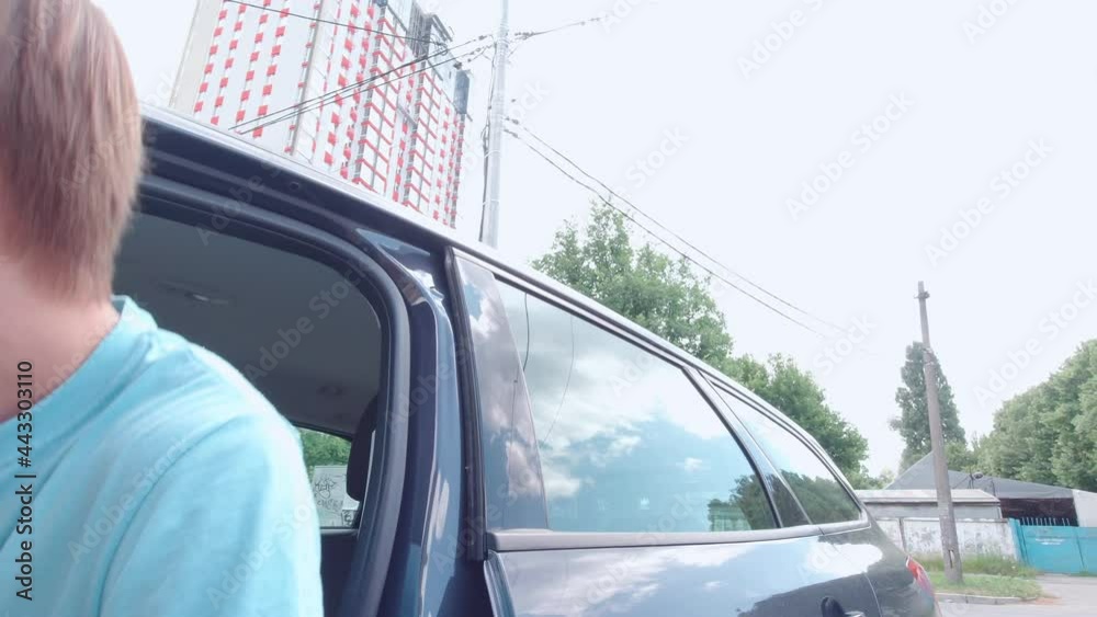 Man gets into the car slow motion interior closeup creative camera movement technique