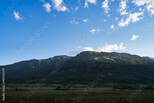 Wild mountains of Hemsedal. The nature is wild and the scenery is set. Golden hour light and dramatic sky. Country life here is not bad. 