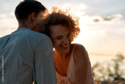 Portrait of laughing young woman and handsome man