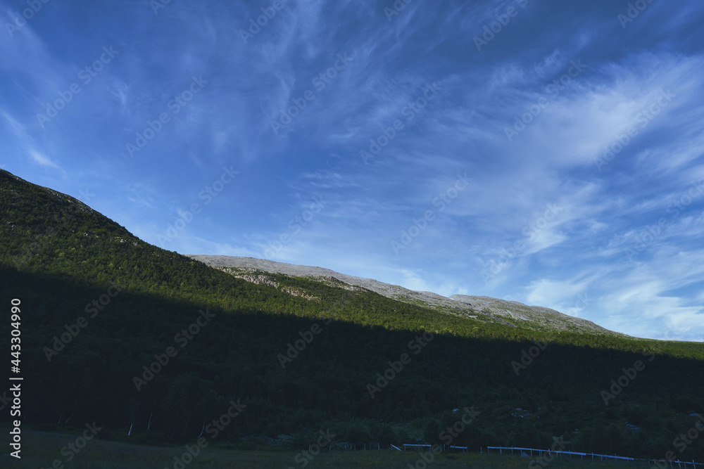 Wild mountains of Hemsedal. The nature is wild and the scenery is set. Golden hour light and dramatic sky. Country life here is not bad. 