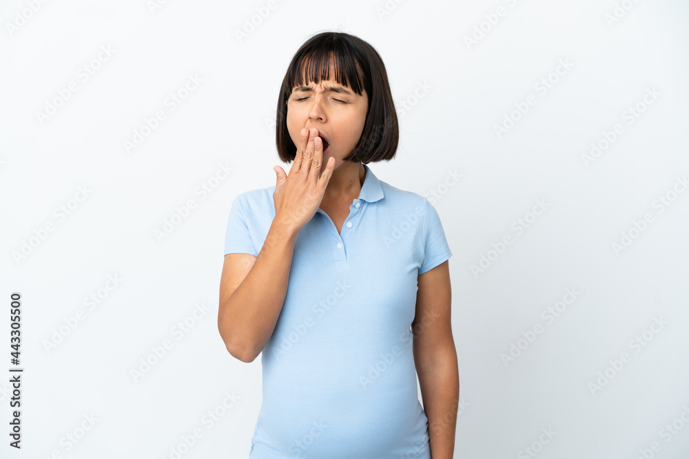 Pregnant woman over isolated white background yawning and covering wide open mouth with hand Pregnant woman over isolated white background yawning and covering wide open mouth with hand