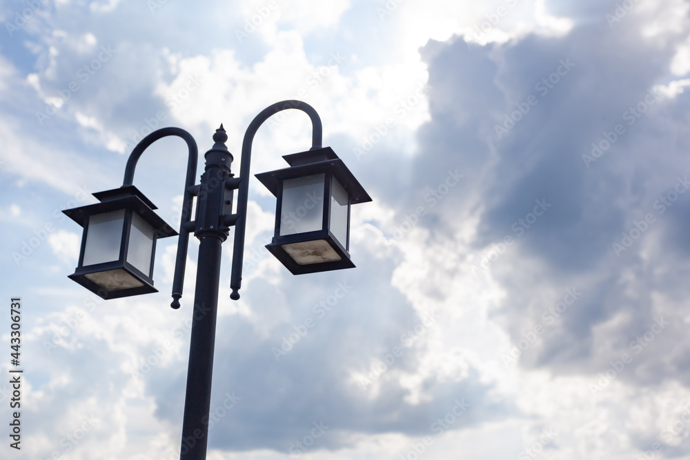 Beautiful street lamp against the sky with clouds, place under the text Beautiful street lamp against the sky with clouds, place under the text