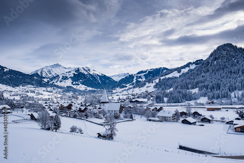 Scenic view of snowy village - Saanen, Switzerland © alsas