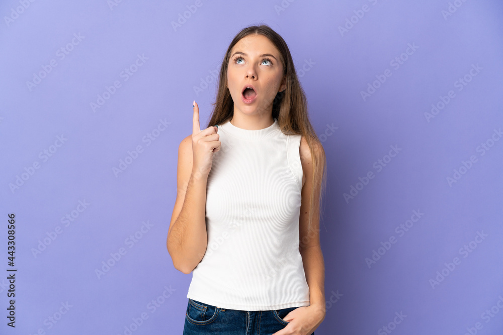 Young Lithuanian woman isolated on purple background thinking an idea pointing the finger up Young Lithuanian woman isolated on purple background thinking an idea pointing the finger up