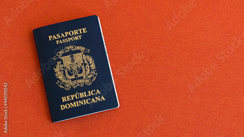 Dominican Republic Passport on a red fabric background