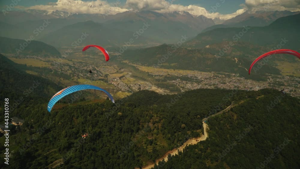 paragliding in the himalayan mountains 