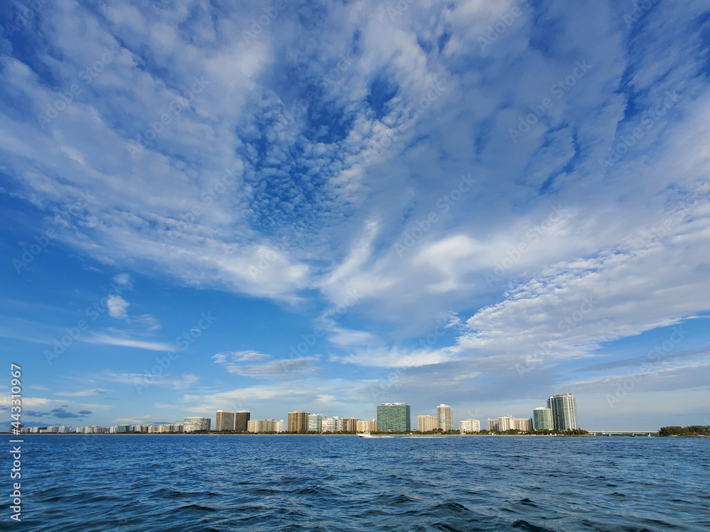 Residential buildings of Bal Harbor Beach, Florida just south of Bakers Haulover Inlet under summer cloudscape.