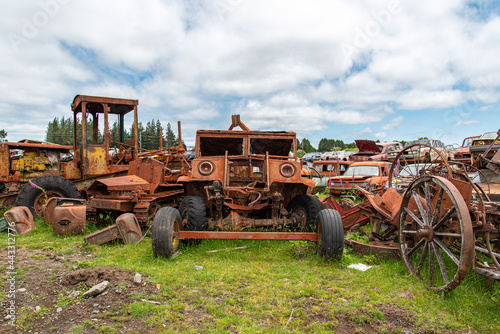 Antique cars on a big scrapyard at the end of Old Coach Road Trail, New Zealand © imagoDens