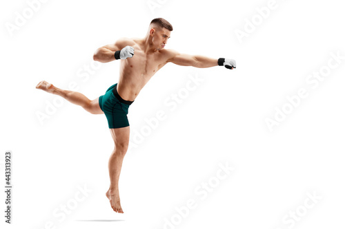 MMA kick. Straight punch. Sport concept. MMA fighter isolated on white background. Athlete