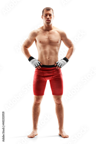 MMA. Sport concept. Fighter isolated on white background. Hands on hips. Athlete