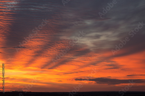 Beautiful atmospheric dramatic clouds in the evening at sunset. Panoramic image.