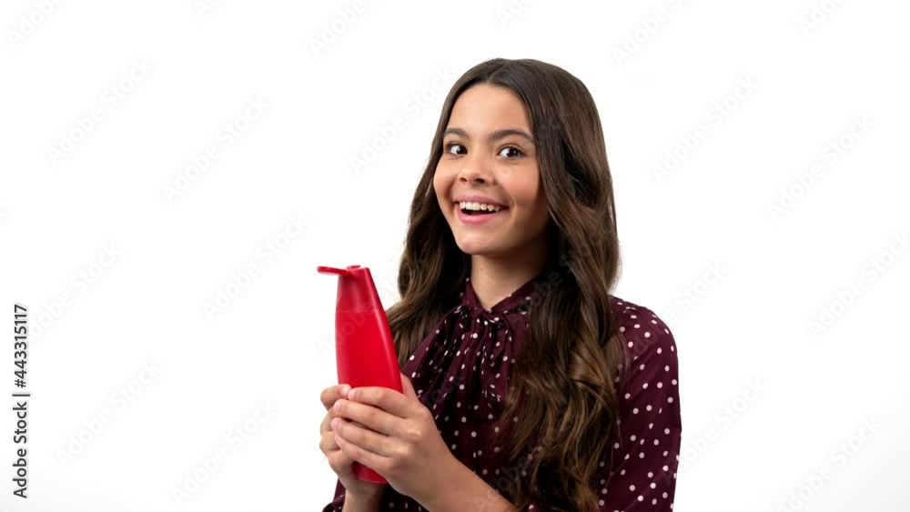 cute kid long curly hair smelling shampoo and having amazed face showing thumb up, beauty. cute kid long curly hair smelling shampoo and having amazed face showing thumb up, beauty.