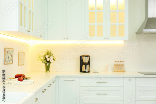 Blurred view of modern kitchen interior with stylish furniture © New Africa