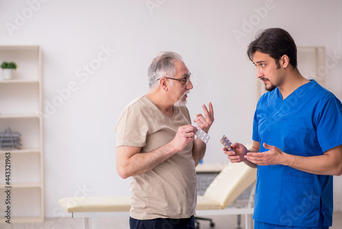 Old male patient visting young male doctor