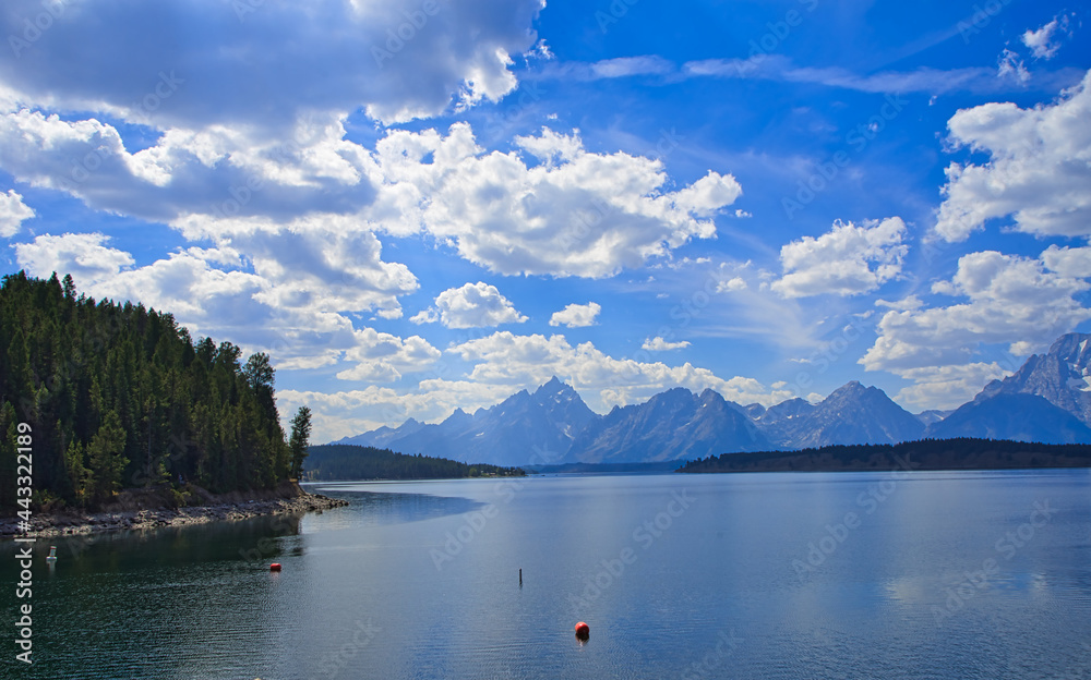 Jackson Lake, crystal lakes, showing reflection and majestic mountains.