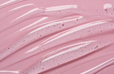 Serum texture on transparent liquid gel background with pink background.