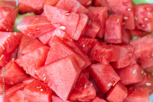 Close up macro view of red ripe cut red watermelon isolated on background.