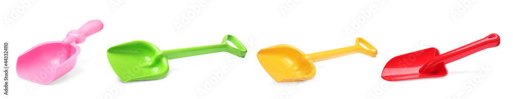 Different bright plastic toy shovels on white background, collage. Banner design Different bright plastic toy shovels on white background, collage. Banner design
