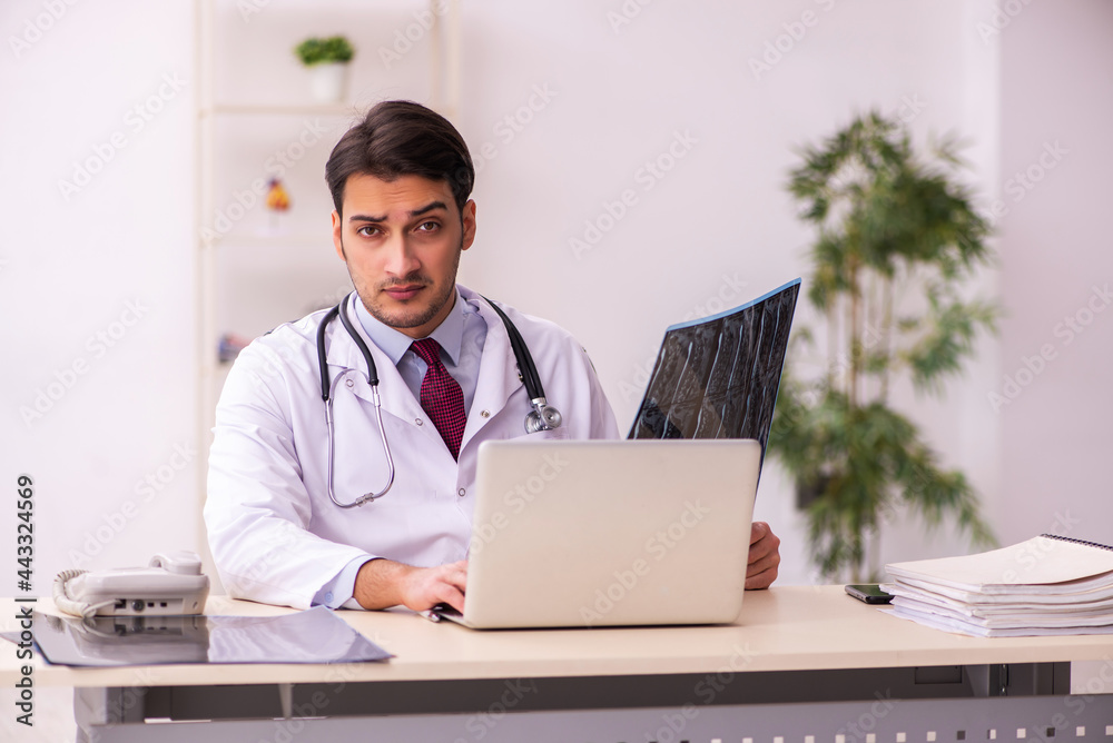 Young male doctor radiologist working in the clinic Young male doctor radiologist working in the clinic
