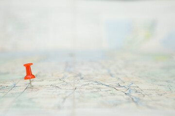 Selective focus of Red pin  on map background