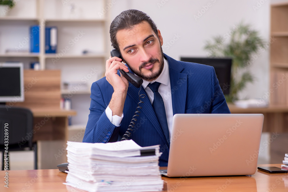 Young businessman employee working at workplace Young businessman employee working at workplace
