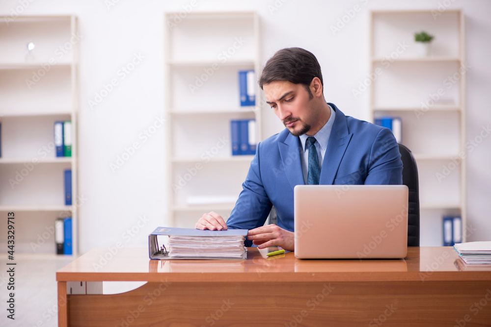 Young businessman employee working in the office Young businessman employee working in the office