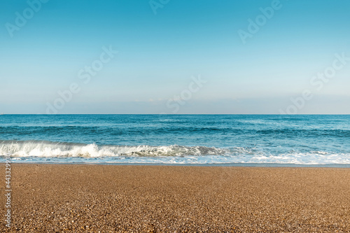 Beach, blue sea, waves. Laptop, rest, walking along the beach.
