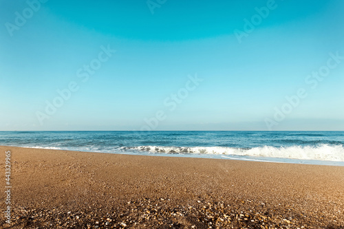 Beach  blue sea  waves. Laptop  rest  walking along the beach.