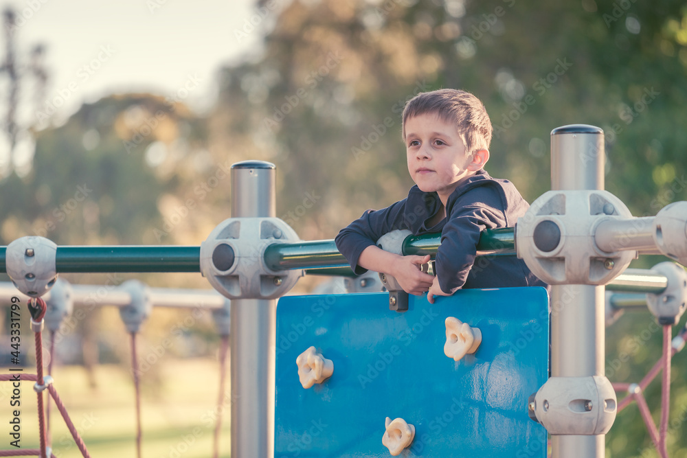 Obraz premium Portrait of the boy on the playground in South Australia on a bright sunny day