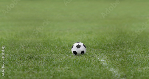 Close up of a football puting on natural grass sports fields