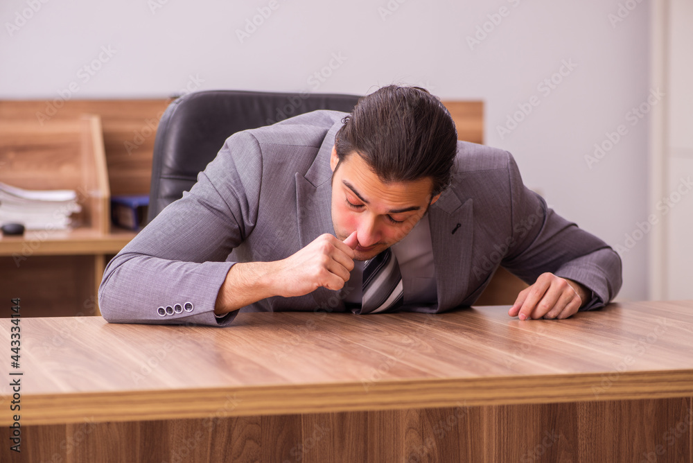 Young businessman employee sitting in the office Young businessman employee sitting in the office