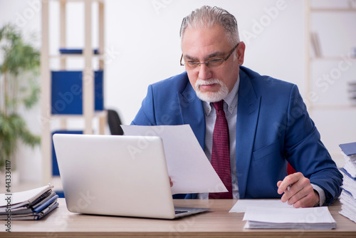 Old male employee and too much work in the office