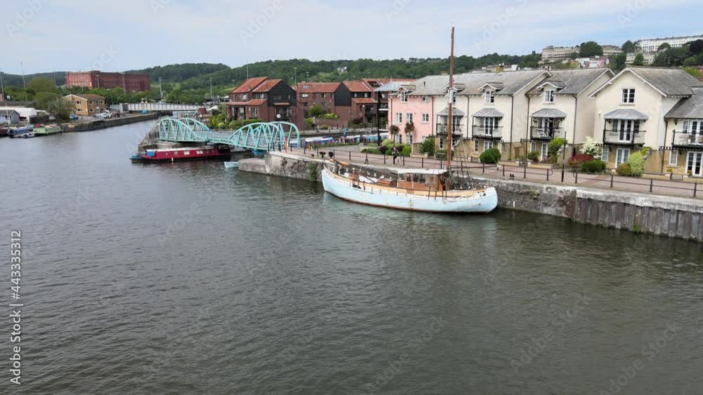 Old Boat moored with riverside houses bristol City UK Aerial footage. Old Boat moored with riverside houses bristol City UK Aerial footage.