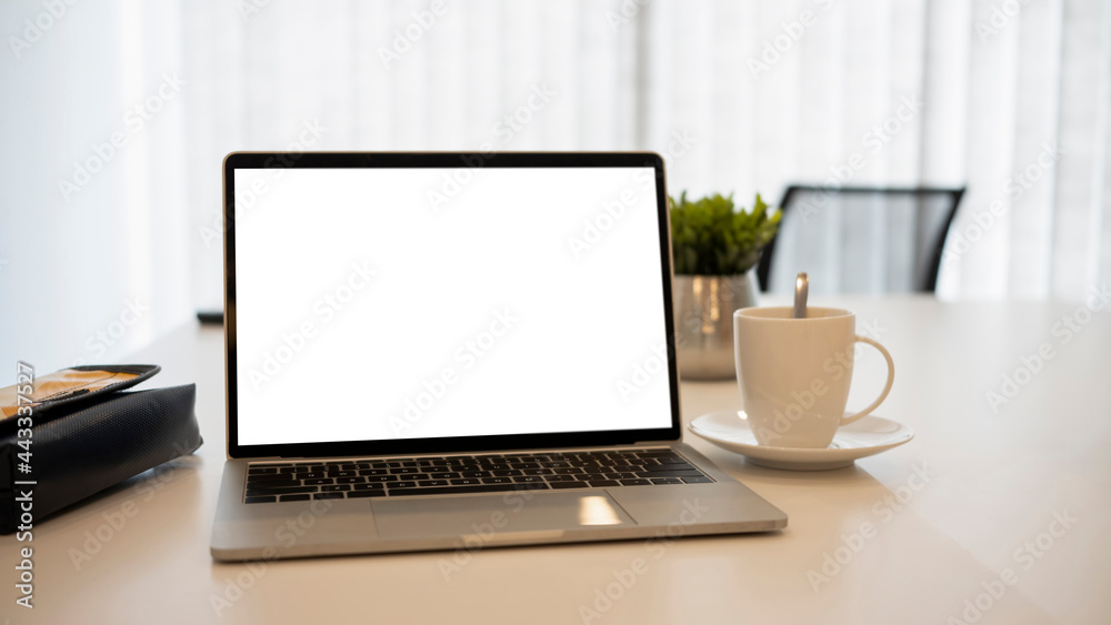 Close up view laptop computer with blank screen on white office desk. Close up view laptop computer with blank screen on white office desk.