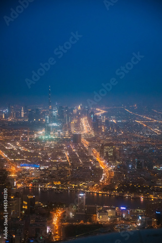 Night Aerial View Of Dubai Cityscape Skyline. Top View Skyline Cityscape City In Night Illuminations. Dubai, United Arab Emirates