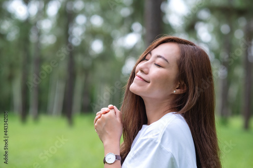 Wallpaper Mural Portrait image of a beautiful asian woman standing in the park Torontodigital.ca