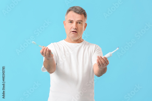 Mature man with tooth brush...