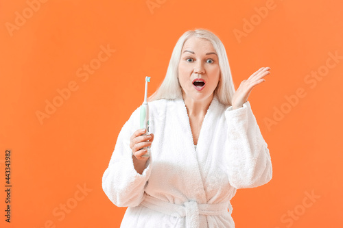 Surprised mature woman with...