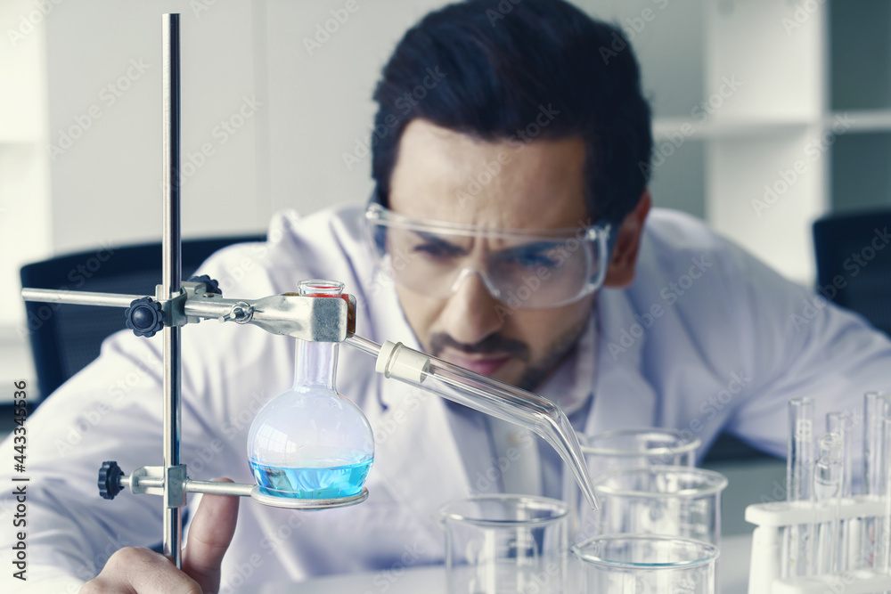 Doctor and microbiologist with vacuum tubes for samples with COVID 19 infection atypical pneumonia virus in laboratory Doctor and microbiologist with vacuum tubes for samples with COVID 19 infection atypical pneumonia virus in laboratory