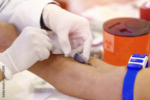 Wallpaper Mural Nurse collecting a blood from patient in hospital Torontodigital.ca