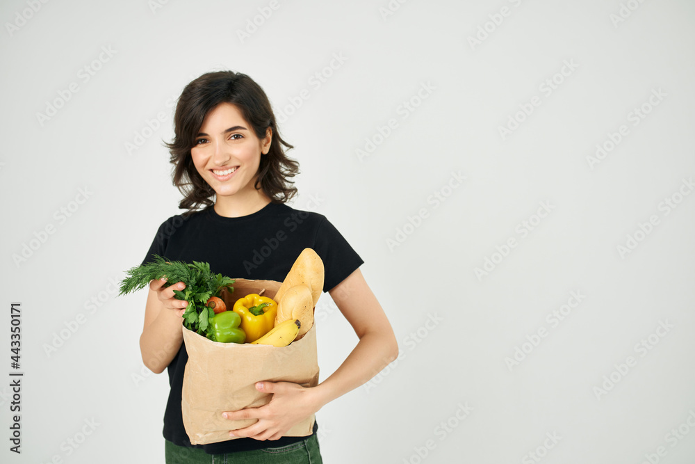 pretty woman with food package healthy food vegetables light background pretty woman with food package healthy food vegetables light background