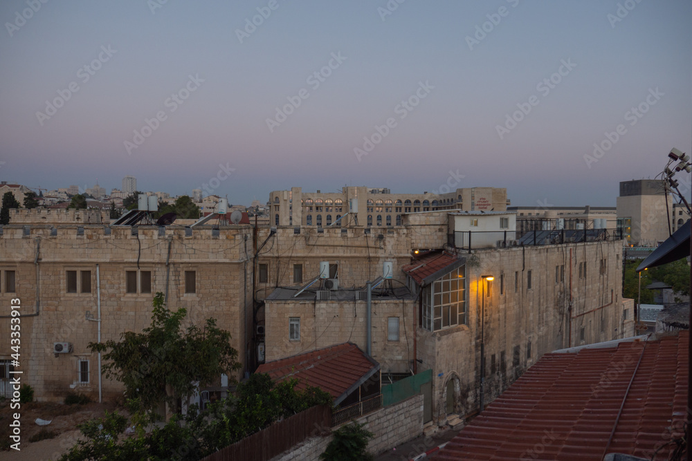 Early morning in the Jerusalem. Sunrise time. City view. Old buildings. Clouds on the sky