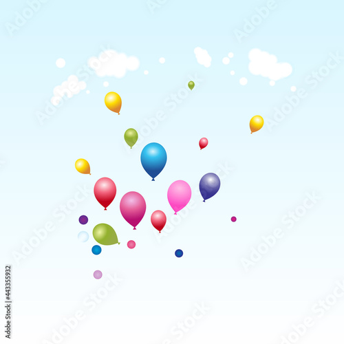 Colorful balloons flying on the blue sky in sunlight in day time below clouds