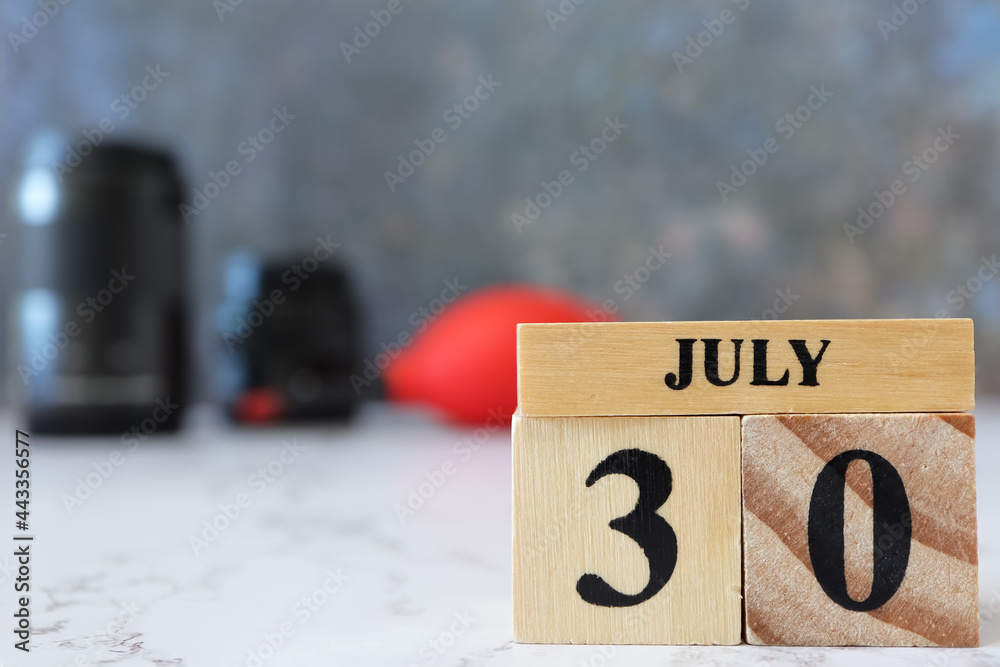 Cube wooden calendar showing date on 30 July. Wooden calendar with date ...