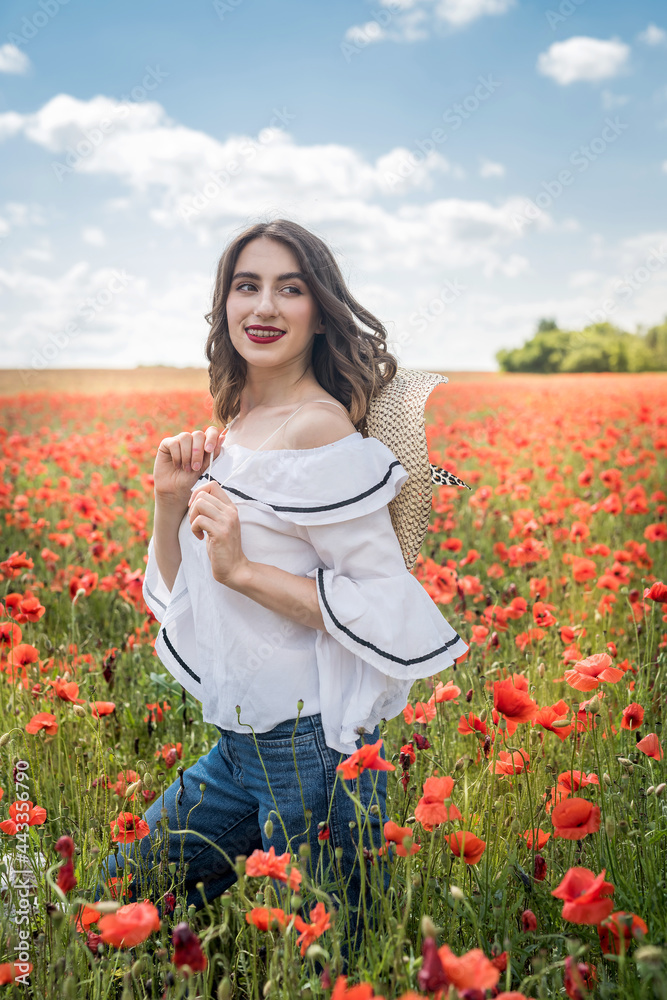 Pretty lady enjoy free time at red poppy field, sunny day Pretty lady enjoy free time at red poppy field, sunny day