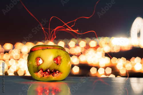 Halloween. Evil apple at night.