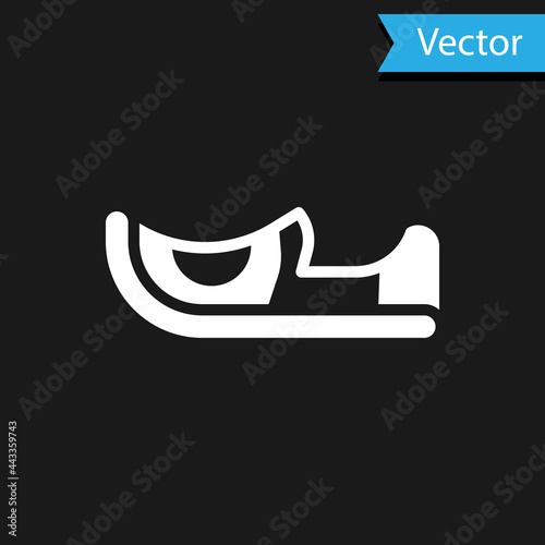 White Traditional indian shoes icon isolated on black background. Vector