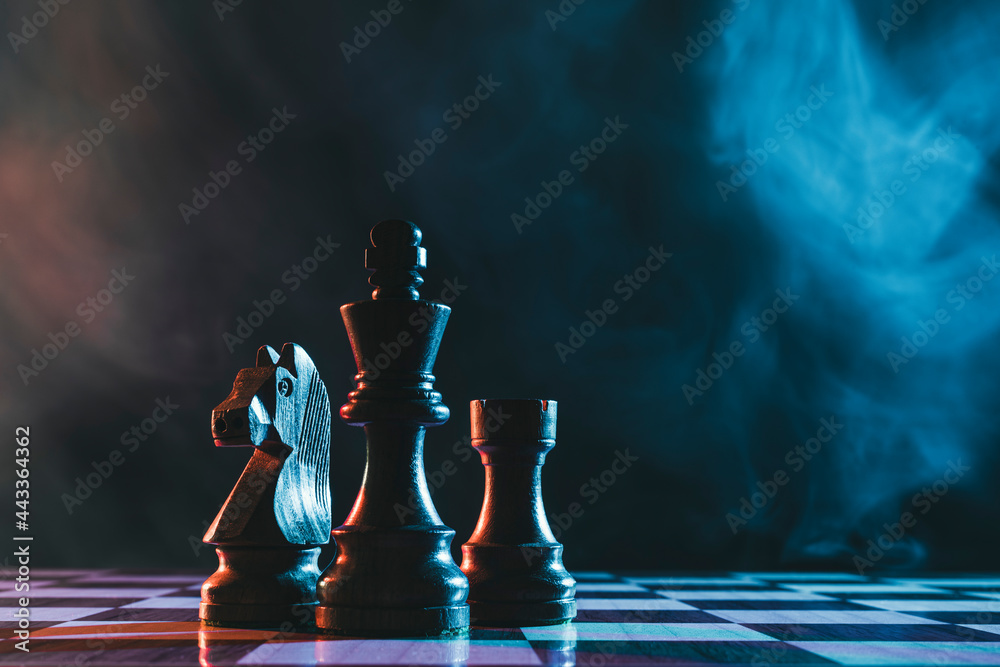 Photography Chess pieces on a dark background